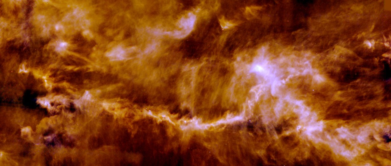 The Taurus molecular cloud imaged in the far infrared by Herschel, showing a network of filaments with compact dense structures